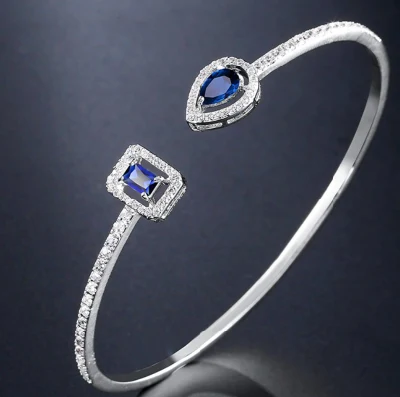 Bracciale rigido alla moda con zirconi cubici blu zaffiro CZ per regalo da donna.  Bracciale da sposa da sposa